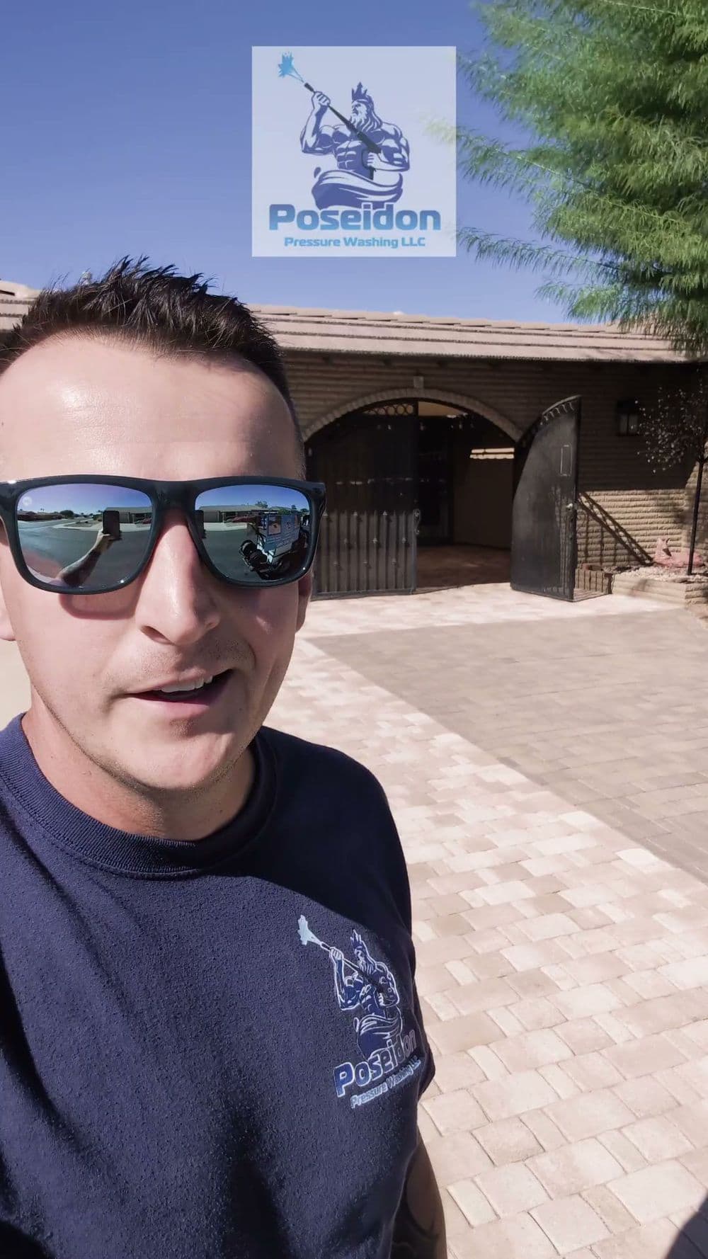 Man in sunglasses standing outside a building with Poseidon Pressure Washing LLC logo.