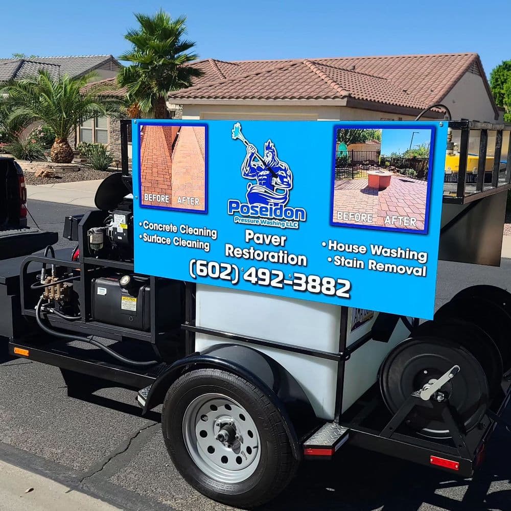 Paver restoration and cleaning service truck with before and after images and contact info.